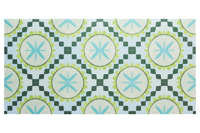 Geometric pattern with green and blue star and circle designs on a light background.