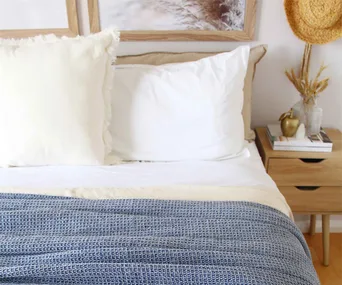 Bunnings throw rug on a coastal style bed