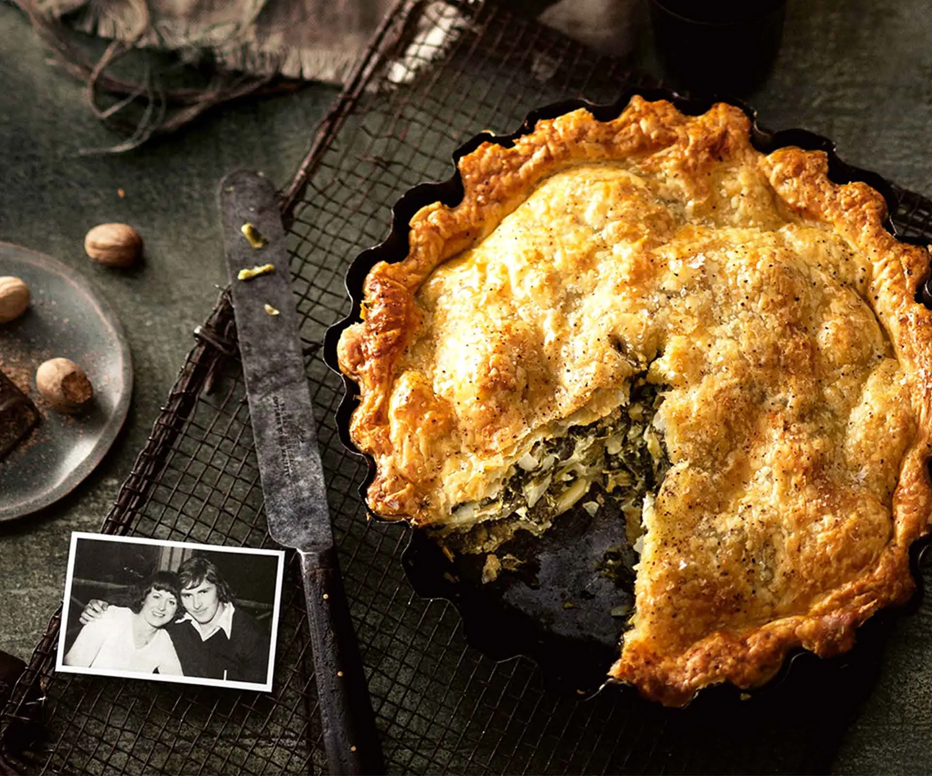 Spinach pie with a slice missing