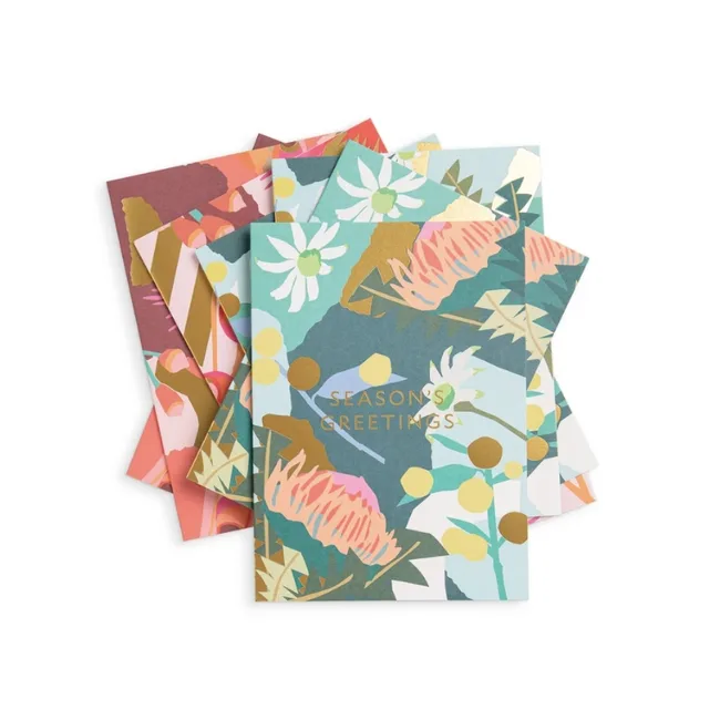 Stack of colorful floral "Season's Greetings" cards with abstract botanical patterns.