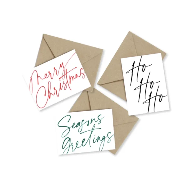 Three holiday greeting cards with phrases: "Merry Christmas," "Ho Ho Ho," and "Seasons Greetings," with envelopes.