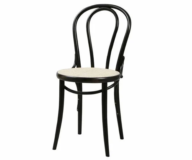 A classic black bentwood chair with a curved backrest and light-colored round seat.
