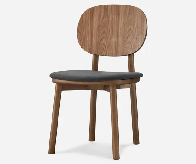 A wooden chair with a curved backrest and dark cushioned seat on a white background.