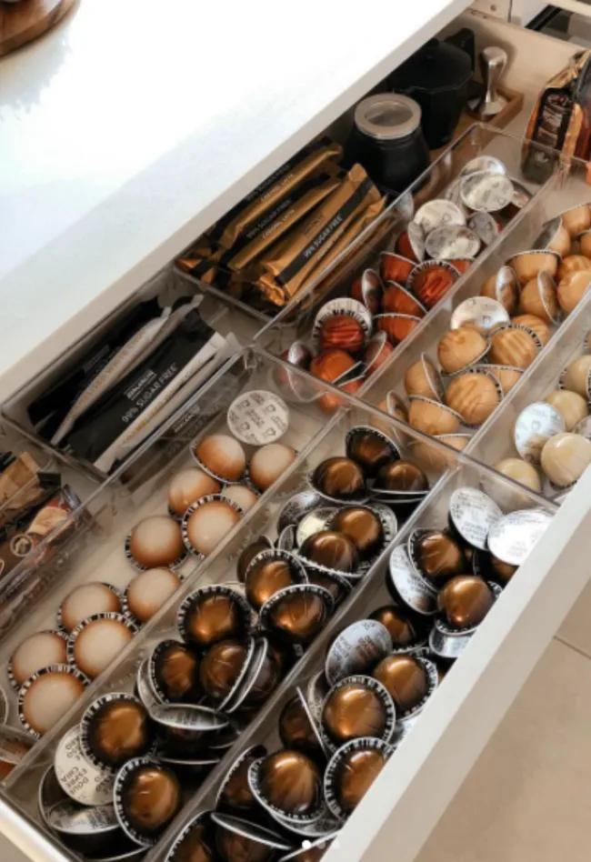 Kmart drawer dividers created this neat coffee drawer that's good enough to be on display.