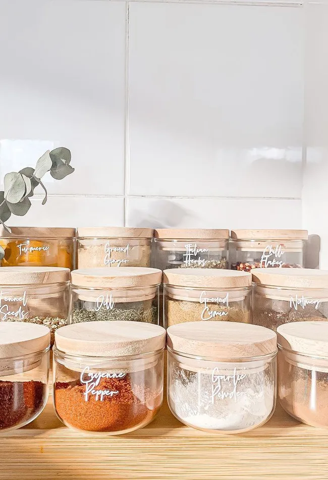 Kmart storage jars customised with cursive print.