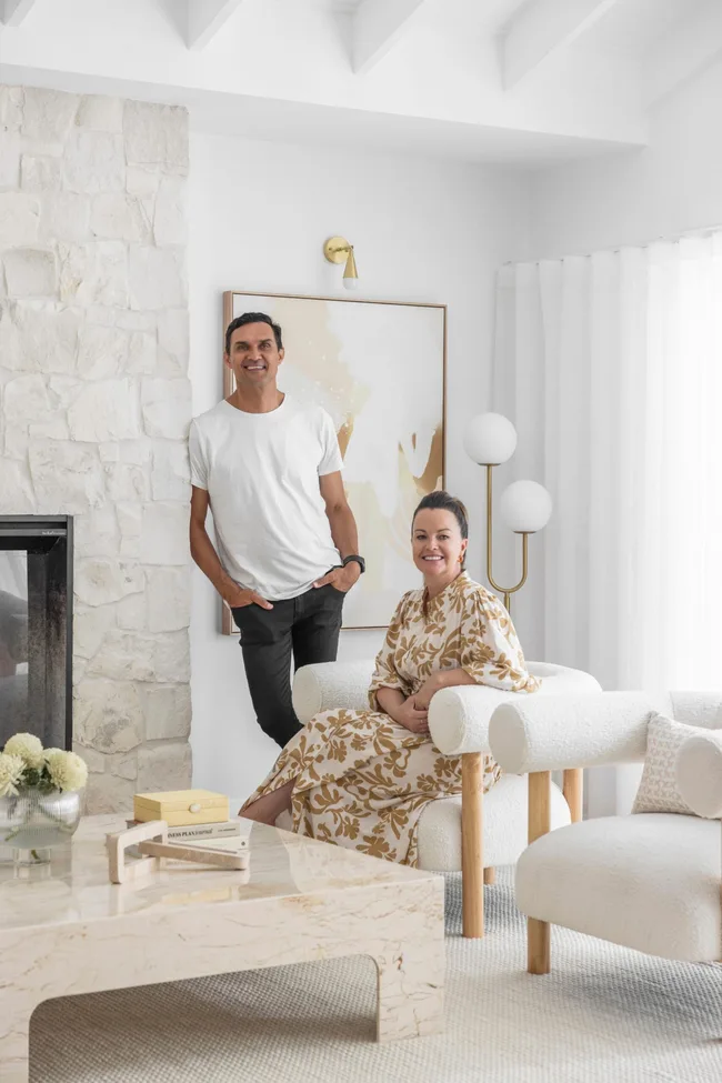Former Block contestants Andy and Deb in a white living room
