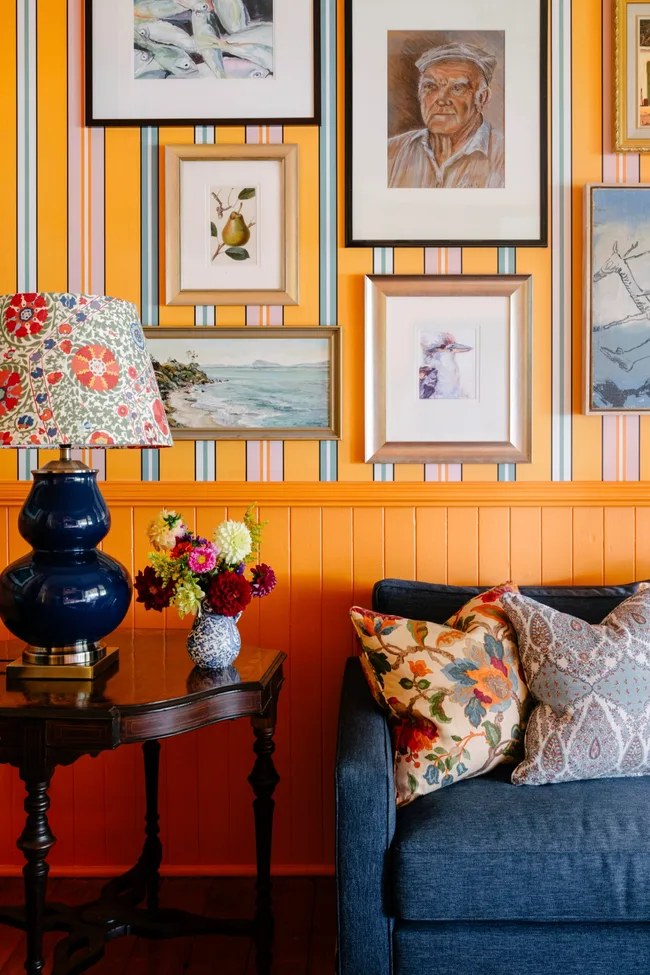 A country living room with orange walls