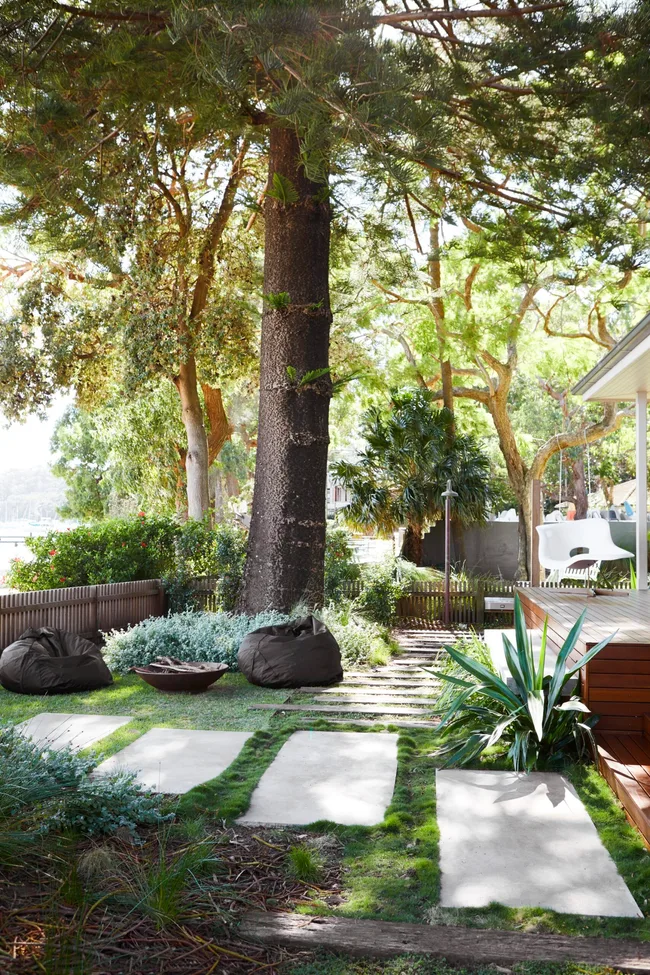 A coastal garden with large pavers and ornamental grass