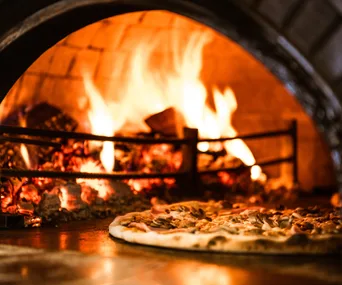 Enjoy a taste of Italy from your backyard with these pizza ovens on sale